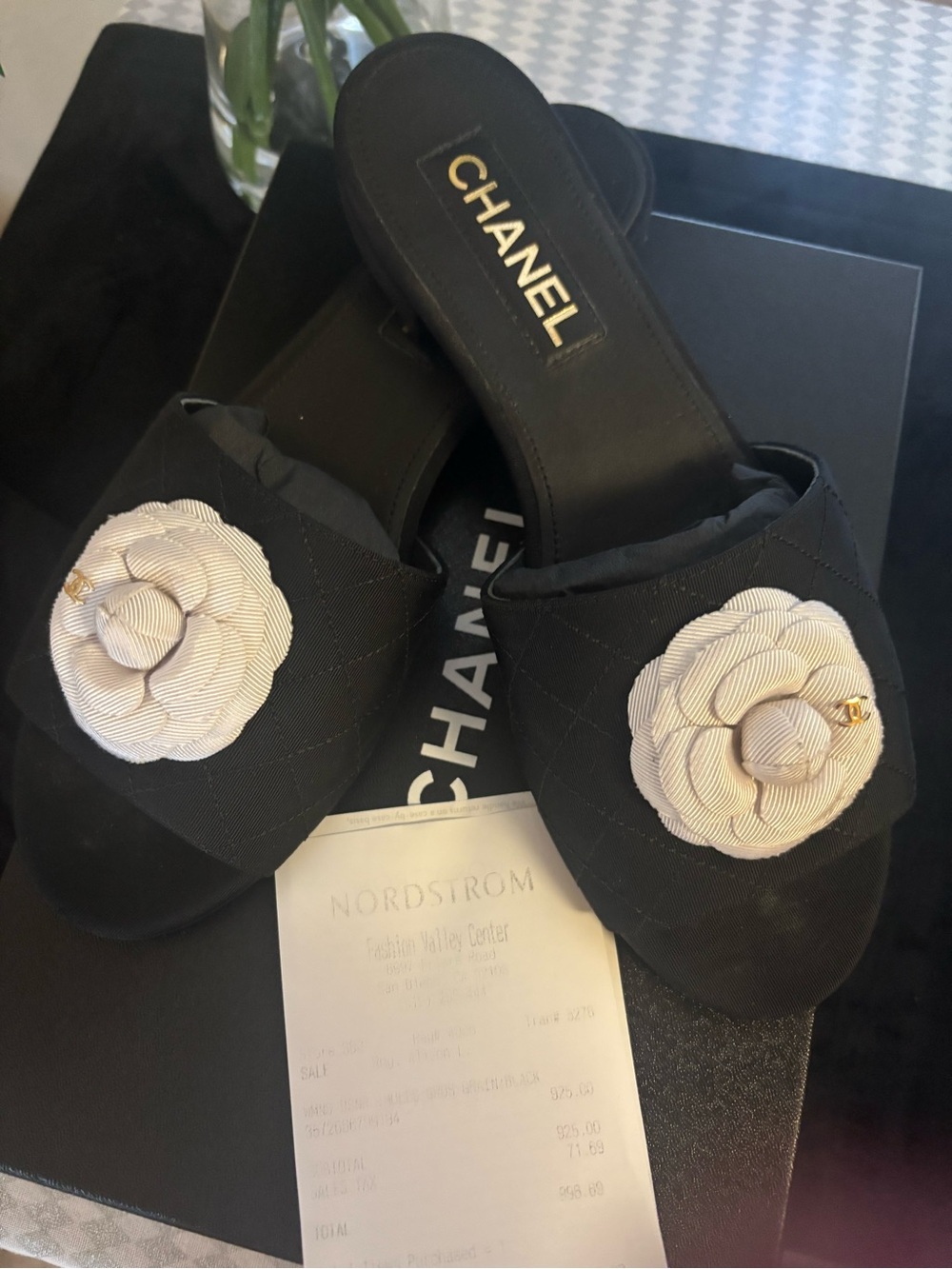 CHANEL Black Quilted Slide Mules with Cream Camellia